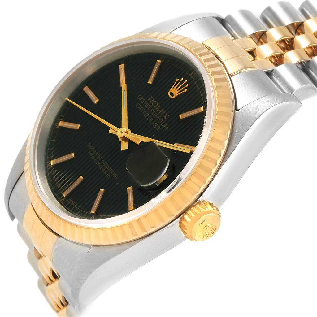 This image shows a close-up side angle of the Rolex Datejust 16233 Men's Steel and Gold (two tone) Black Dial 16233 Men's Steel and Gold (two tone) Black Dial watch, highlighting the black dial, gold bezel, crown, and part of the bracelet.