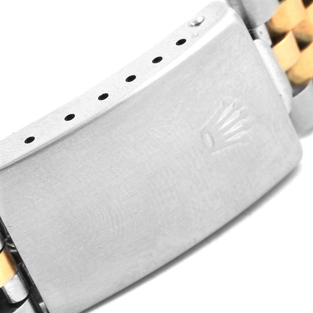 This image shows a close-up of the clasp on a Rolex Datejust 16233 Men's Steel and Gold (two tone) Black Dial 16233 Men's Steel and Gold (two tone) Black Dial watch bracelet.