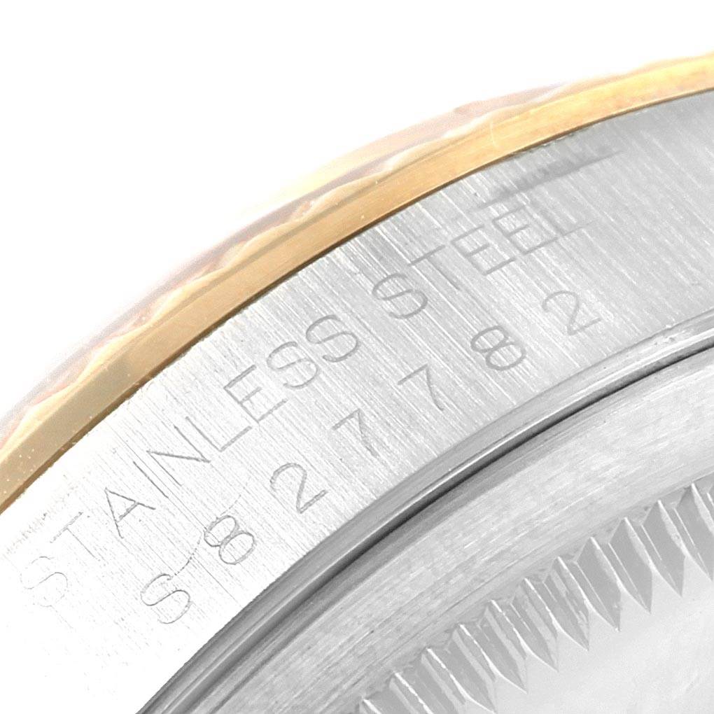 This close-up image shows the stainless steel casing and engraved serial number of the Rolex Datejust 16233 Men's Steel and Gold (two tone) Black Dial 16233 Men's Steel and Gold (two tone) Black Dial watch.