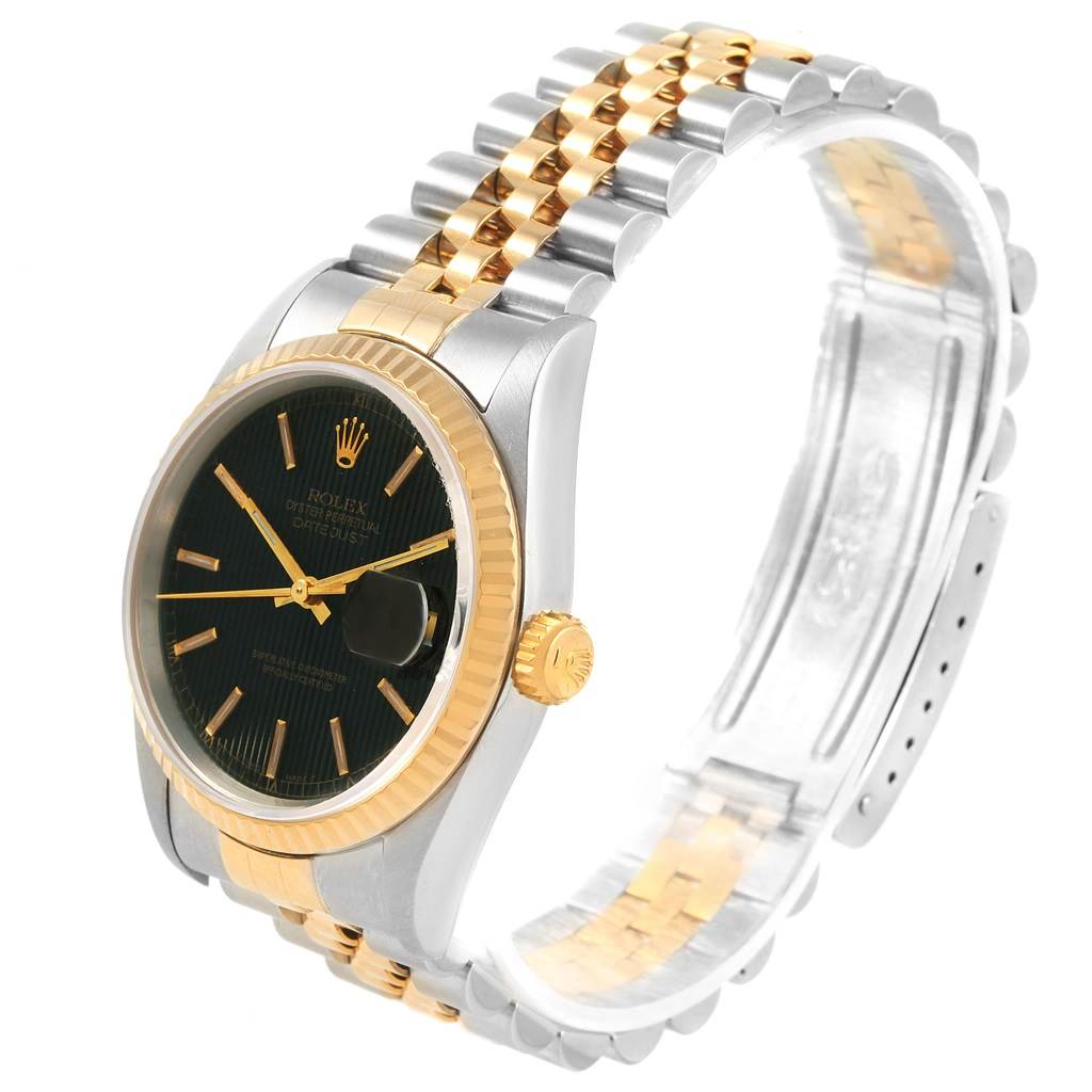 This Rolex Datejust 16233 Men's Steel and Gold (two tone) Black Dial 16233 Men's Steel and Gold (two tone) Black Dial watch is shown from an angle displaying the face, crown, fluted bezel, and two-tone Jubilee bracelet.