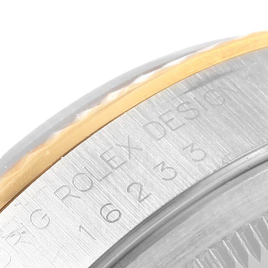 The image shows a close-up of the rim and edge, highlighting the engraved text on a Rolex Datejust 16233 Men's Steel and Gold (two tone) Black Dial 16233 Men's Steel and Gold (two tone) Black Dial watch.
