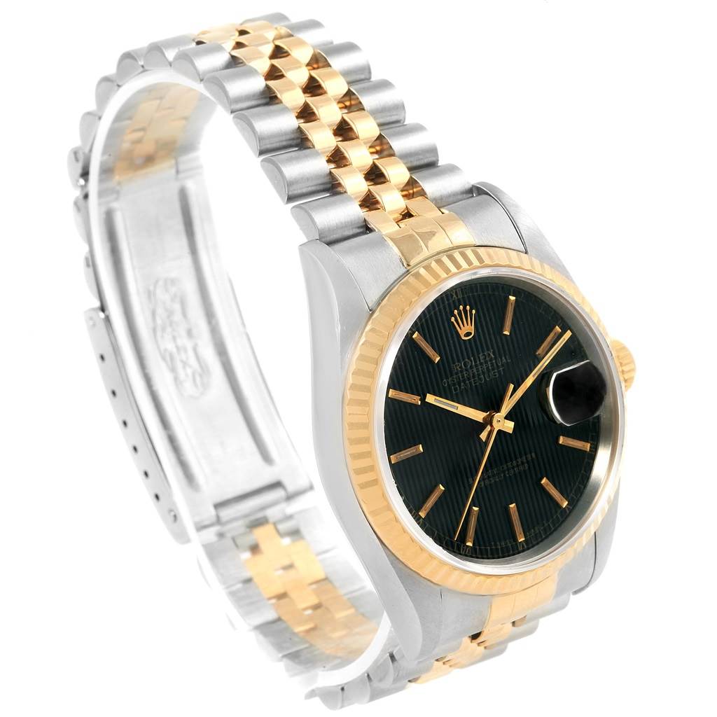 This image shows a Rolex Datejust 16233 Men's Steel and Gold (two tone) Black Dial 16233 Men's Steel and Gold (two tone) Black Dial watch angled from the left side, displaying the face, bezel, and bracelet.