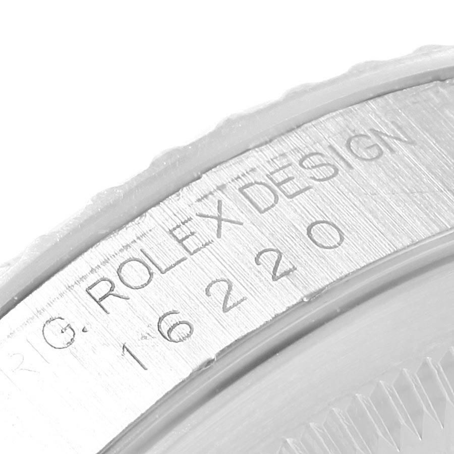 This image shows a close-up of the serial number engraving on the side of a Rolex Datejust 16220 Men's Stainless Steel Silver Dial 16220 Men's Stainless Steel Silver Dial watch case.