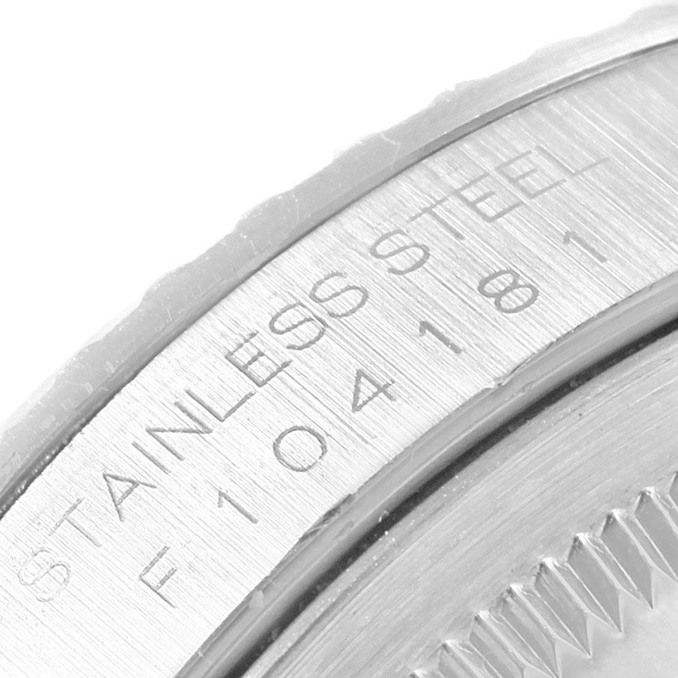 This image shows a close-up of the stainless steel engraved area on the case back of a Rolex Datejust 16220 Men's Stainless Steel Silver Dial 16220 Men's Stainless Steel Silver Dial watch.