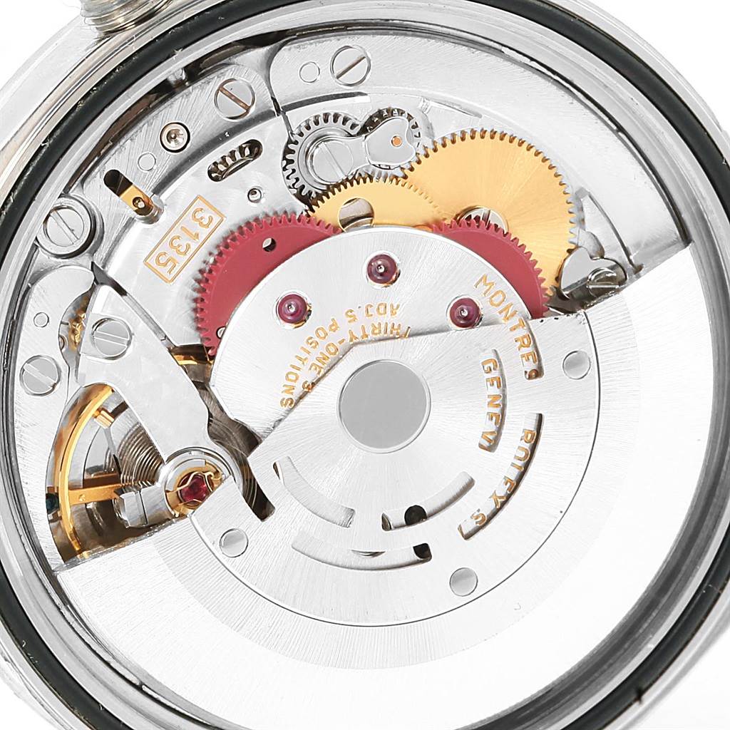 This image shows a close-up of the intricate internal movement mechanism of the Rolex Datejust 16220 Men's Stainless Steel Silver Dial 16220 Men's Stainless Steel Silver Dial watch.