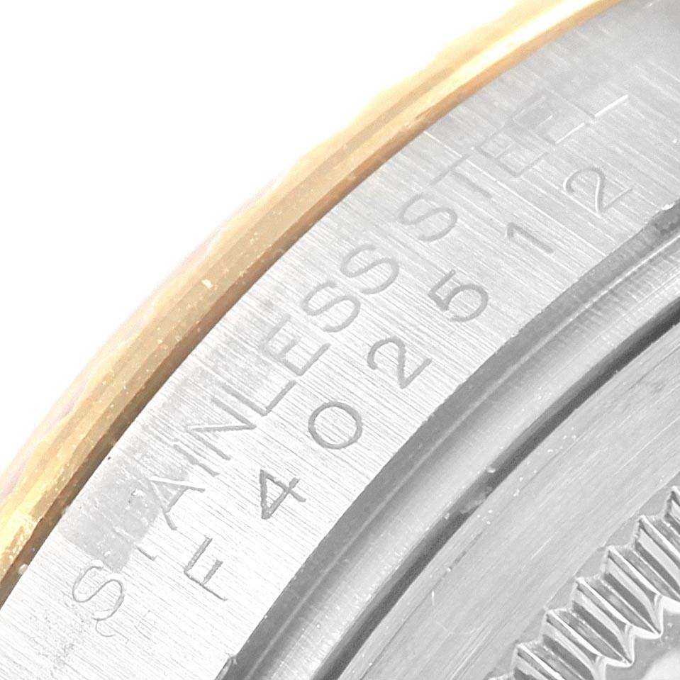 This close-up image shows the stainless steel case-back edge of a Rolex Datejust 116233 Men's Stainless Steel Champagne Dial 116233 Men's Stainless Steel Champagne Dial watch.