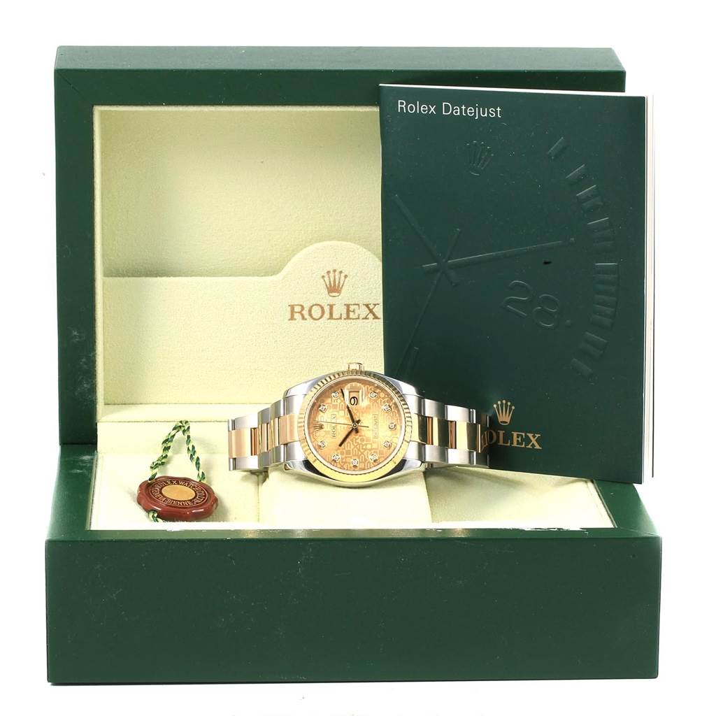 The image shows a frontal view of a Rolex Datejust 116233 Men's Stainless Steel Champagne Dial 116233 Men's Stainless Steel Champagne Dial watch in its box with accompanying booklets and tags.