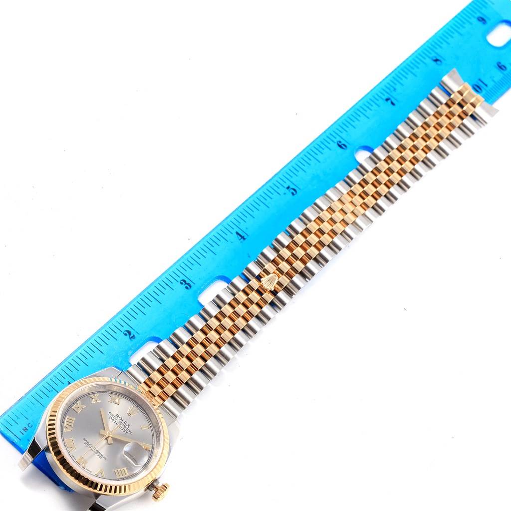 The image shows a Rolex Datejust 116233 Men's Stainless Steel Silver Dial 116233 Men's Stainless Steel Silver Dial watch laid flat with a ruler next to it, highlighting the bracelet and watch face.