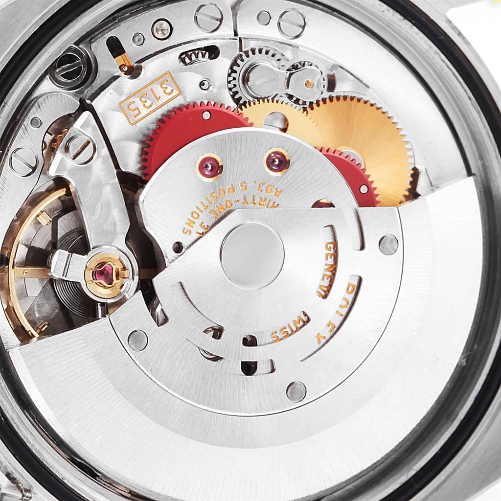 The image shows the internal mechanical movement of the Rolex Datejust 116234 Men's Stainless Steel White Dial 116234 Men's Stainless Steel White Dial watch, highlighting gears, springs, and the rotor.
