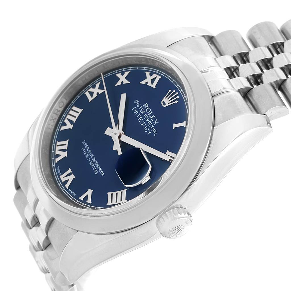 The image shows a close-up at an angle of the Rolex Datejust 116200 Men's Stainless Steel Blue Dial 116200 Men's Stainless Steel Blue Dial watch, highlighting the blue dial, Roman numerals, crown, and part of the bracelet.