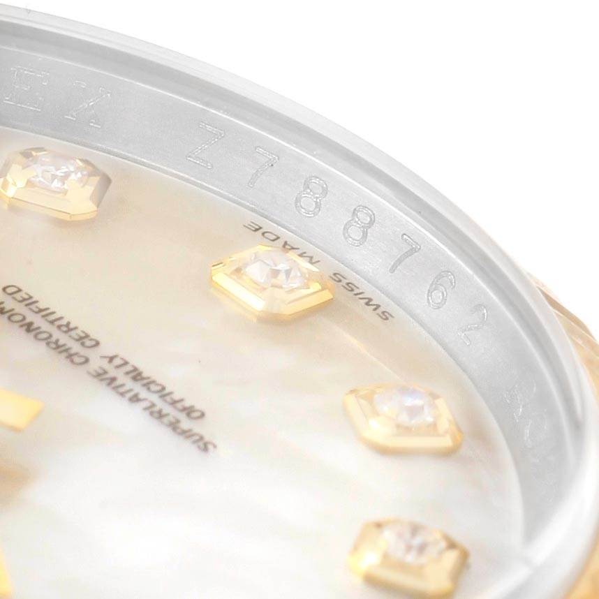 The image shows a close-up of the dial and rehaut of a Rolex Datejust 116233 Men's Stainless Steel Mother of Pearl Dial 116233 Men's Stainless Steel Mother of Pearl Dial model, highlighting the serial number and markers.