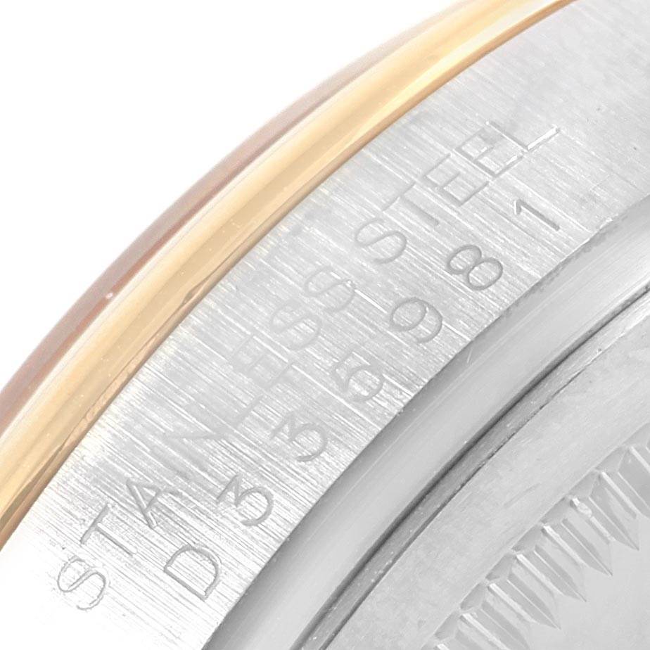 This image shows a close-up of the side of a Rolex Datejust 116203 Men
s Stainless Steel Champagne Dial 116203 Men
s Stainless Steel Champagne Dial model casing, highlighting the engraved serial numbers and part of the bezel.