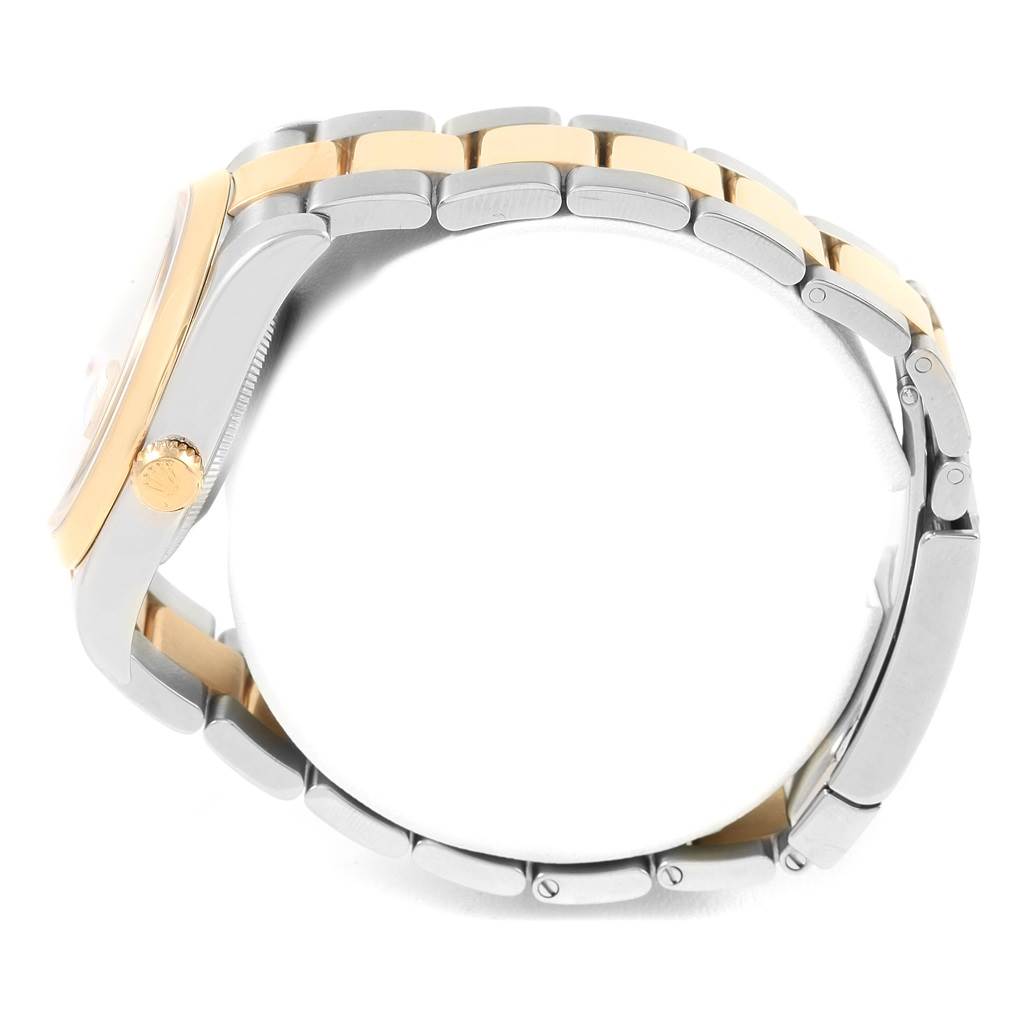 This image shows a side view of the Rolex Datejust 116203 Men
s Stainless Steel Champagne Dial 116203 Men
s Stainless Steel Champagne Dial watch, highlighting the crown and part of the bracelet.