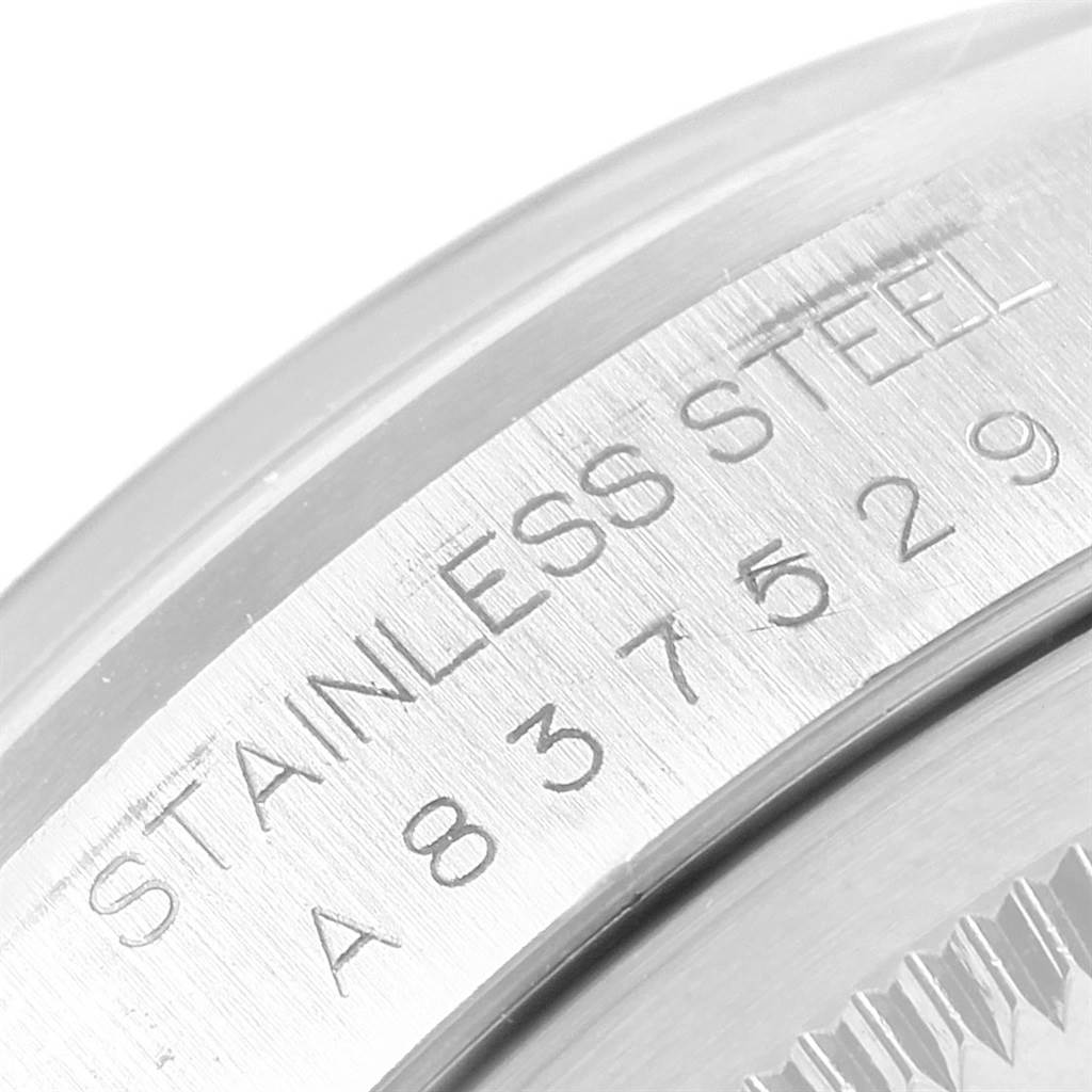 The close-up image shows the serial number and stainless steel engraving on the side of the bezel of the Rolex Datejust 16200 Men's Stainless Steel Blue Dial 16200 Men's Stainless Steel Blue Dial.