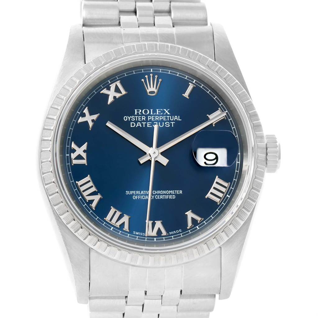 The image shows a Rolex Datejust 16220 Men's Stainless Steel Blue Dial 16220 Men's Stainless Steel Blue Dial watch, featuring a blue dial with Roman numerals, a date window at 3 o'clock, and a silver Jubilee bracelet.