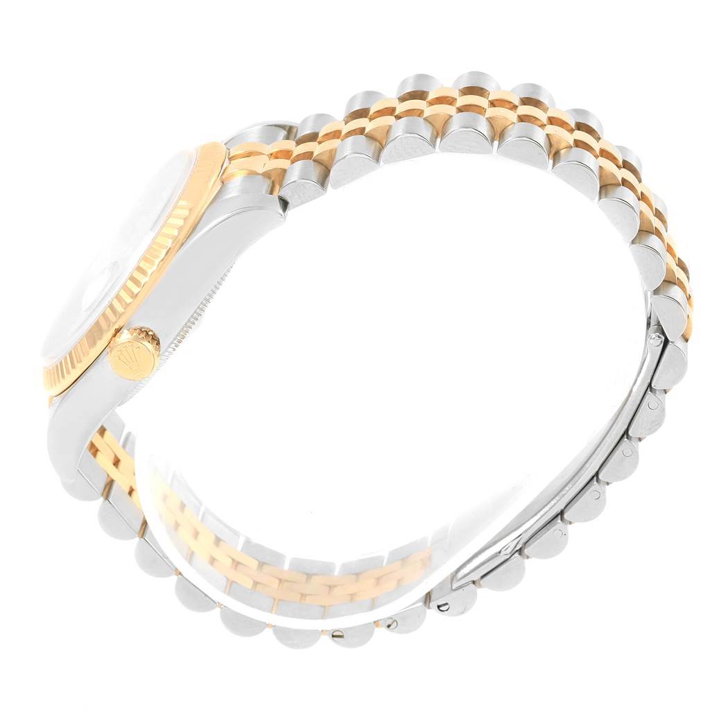 The image shows a side view of a Rolex Datejust 116233 Men's Stainless Steel Champagne Dial 116233 Men's Stainless Steel Champagne Dial watch, highlighting its two-tone bracelet, crown, and case.