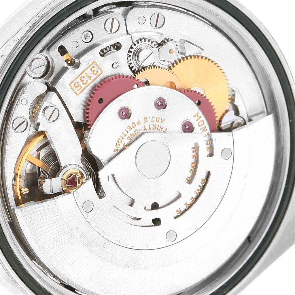 This is a close-up view of the internal mechanism of a Rolex Datejust 16200 Men's Stainless Steel Blue Dial 16200 Men's Stainless Steel Blue Dial watch, showing gears and other mechanical components.