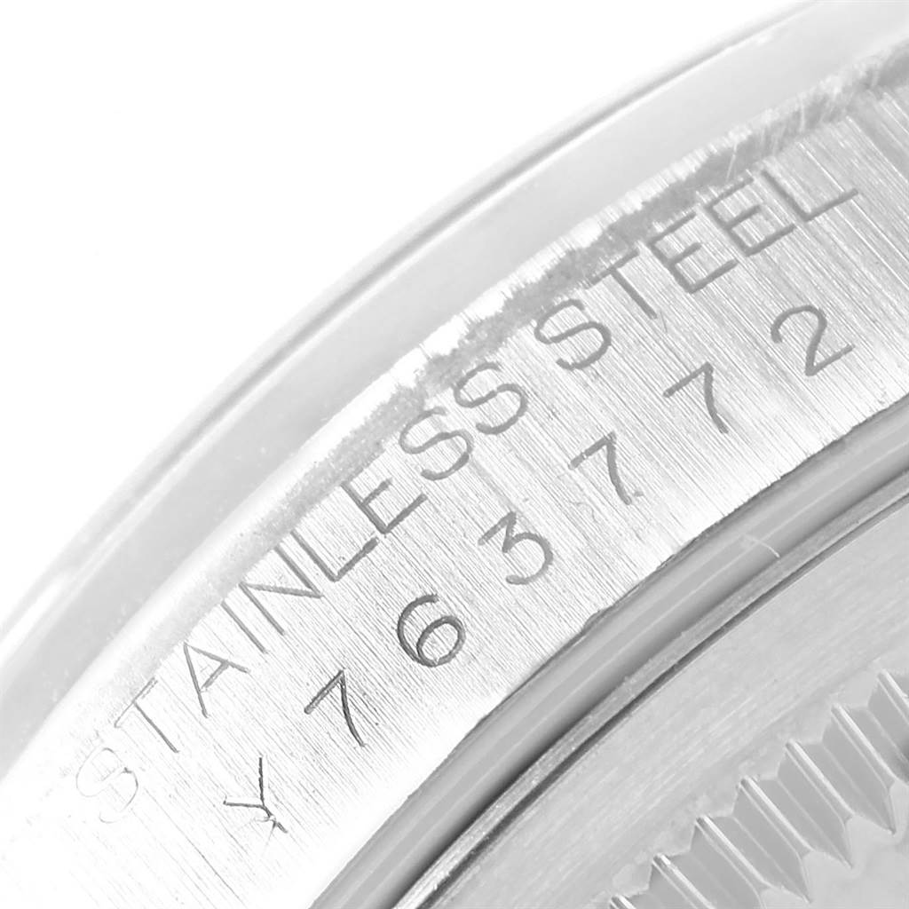 This is a close-up image of the case back engraving on a Rolex Datejust 16200 Men's Stainless Steel Blue Dial 16200 Men's Stainless Steel Blue Dial model, showing "STAINLESS STEEL" and partial serial number.