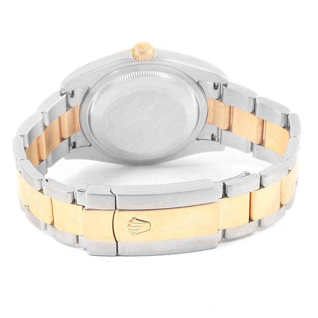 This image shows the back of a Rolex Datejust 116233 Men's Stainless Steel White Dial 116233 Men's Stainless Steel White Dial watch case and its two-tone bracelet clasp.