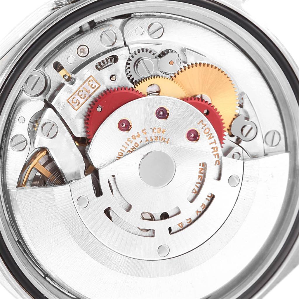 This image shows a close-up view of the internal mechanism of a Rolex Datejust 16234 Men's Stainless Steel Black Dial 16234 Men's Stainless Steel Black Dial watch, highlighting its gears and movement components.