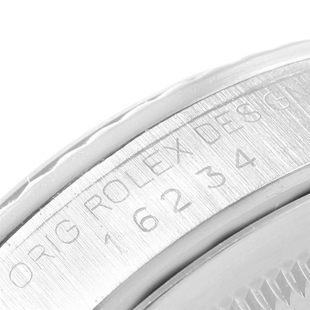 This close-up angle of the Rolex Datejust 16234 Men's Stainless Steel Black Dial 16234 Men's Stainless Steel Black Dial watch shows the engraved inner bezel with the model number.