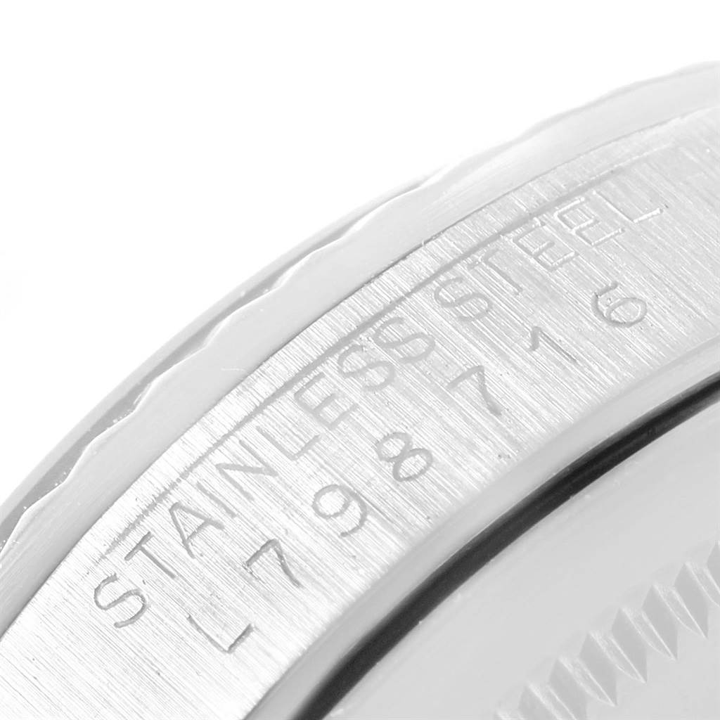 The image shows a close-up of the caseback and bezel of the Rolex Datejust 16234 Men's Stainless Steel Black Dial 16234 Men's Stainless Steel Black Dial, highlighting the engraved details.