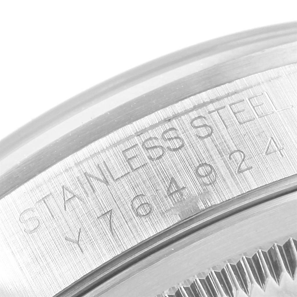 This close-up image shows the stainless steel engraving on the side of the case of a Rolex Datejust 16200 Men's Stainless Steel Black Dial 16200 Men's Stainless Steel Black Dial watch.