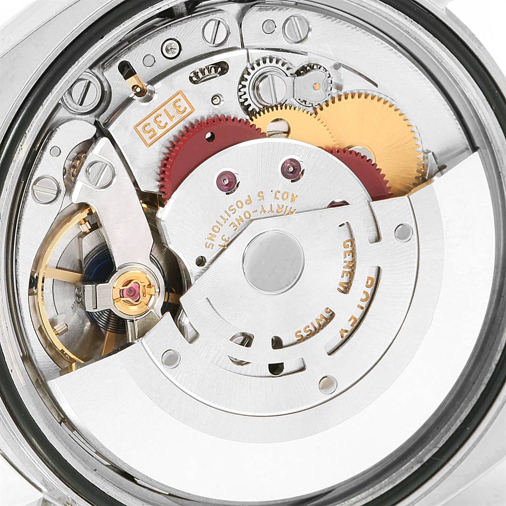 This image shows a close-up of the internal movement components of a Rolex Datejust 116200 Men's Stainless Steel White Dial 116200 Men's Stainless Steel White Dial watch.
