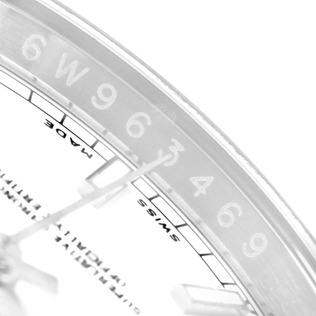 This close-up image shows the minute and hour hands, and part of the dial and bezel of the Rolex Datejust 116200 Men's Stainless Steel White Dial 116200 Men's Stainless Steel White Dial watch.