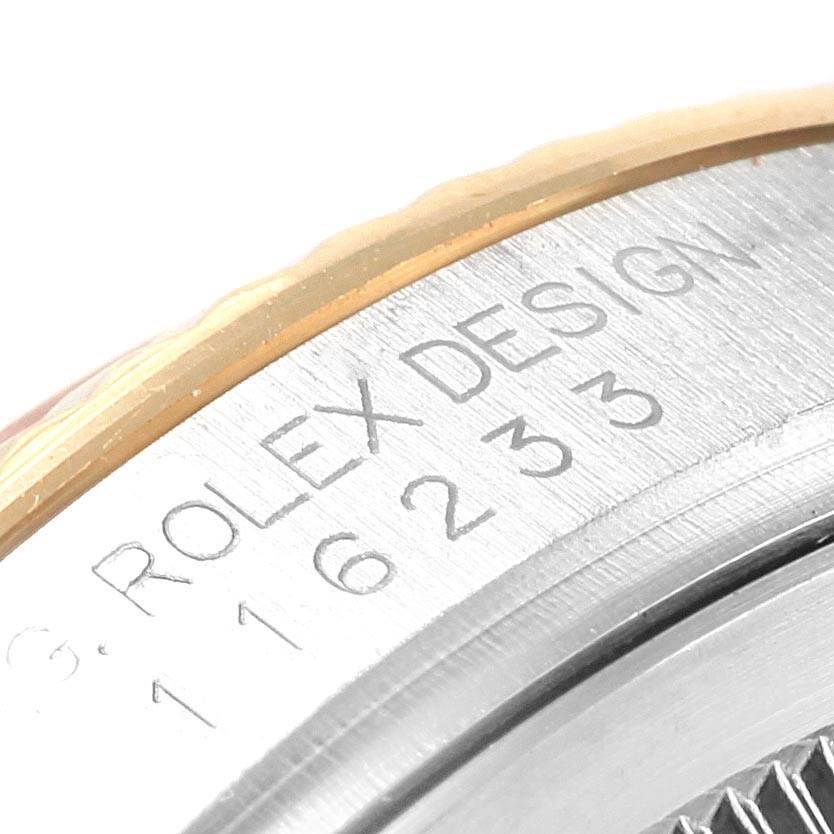 The image shows a close-up of the side of a Rolex Datejust 116233 Stainless Steel Mother of Pearl Dial 116233 Stainless Steel Mother of Pearl Dial watch, displaying the "ROLEX DESIGN" engraving.