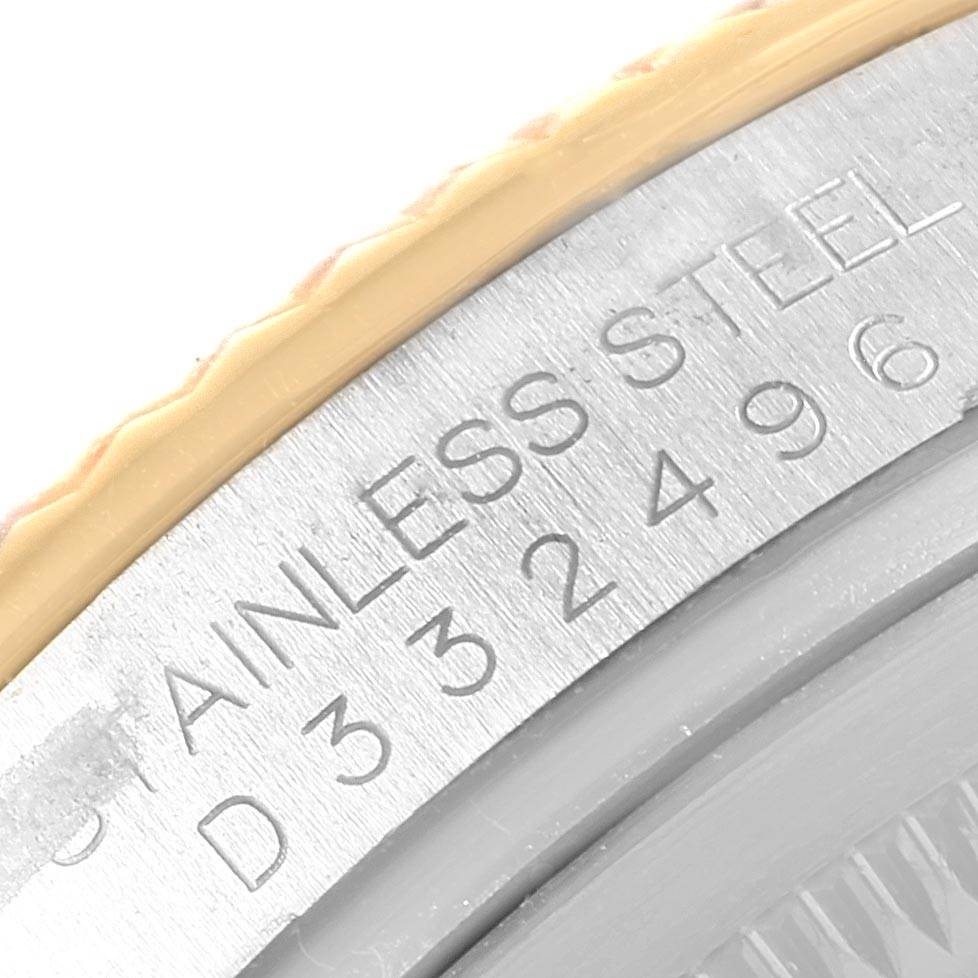 This close-up photo shows part of the casing with engraved text of a Rolex Datejust 116233 Stainless Steel Mother of Pearl Dial 116233 Stainless Steel Mother of Pearl Dial watch.