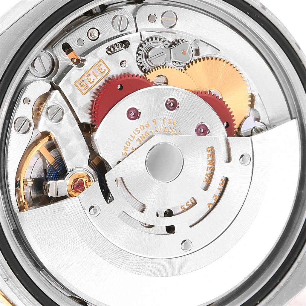 The image shows a close-up view of the movement and internal components of a Rolex Datejust 116243 Women's Stainless Steel Champagne Dial 116243 Women's Stainless Steel Champagne Dial watch.