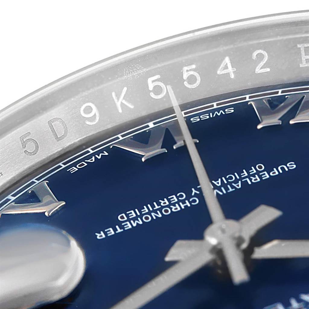The image shows a close-up of the dial, hands, and part of the rehaut of the Rolex Datejust 116200 Men's Stainless Steel Blue Dial 116200 Men's Stainless Steel Blue Dial watch.