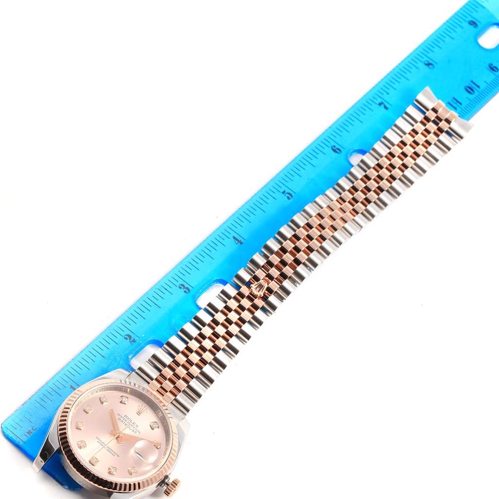 The image shows a Rolex Datejust 116231 Steel and Gold (two tone) Pink Dial 116231 Steel and Gold (two tone) Pink Dial watch face and band, measured against a blue ruler.