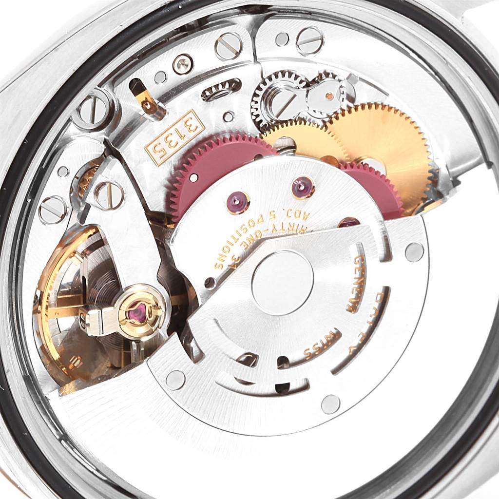 This image shows a close-up view of the movement and internal mechanisms of the Rolex Datejust 116231 Steel and Gold (two tone) Pink Dial 116231 Steel and Gold (two tone) Pink Dial watch model.
