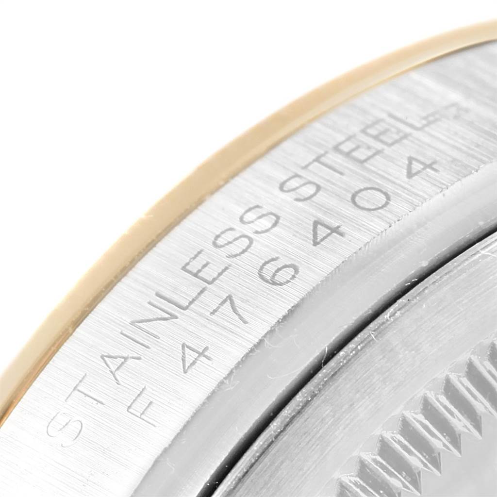 Close-up of the case side and bezel of a Rolex Datejust 116203 Men's Steel and Gold (two tone) Black Dial 116203 Men's Steel and Gold (two tone) Black Dial, showing the engraved "STAINLESS STEEL" and model number.