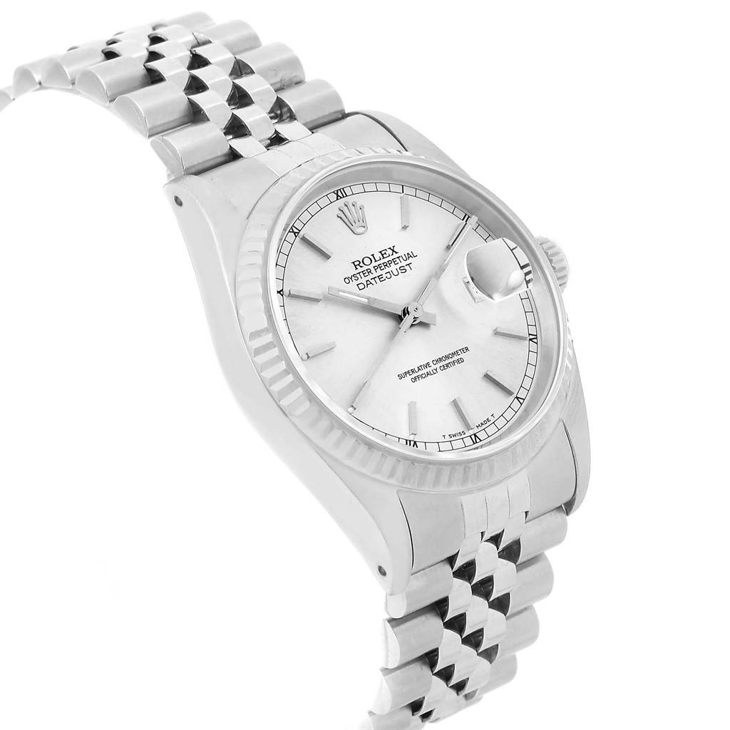 This image shows a stainless steel Rolex Datejust 16234 Men's Stainless Steel Silver Dial 16234 Men's Stainless Steel Silver Dial watch angled slightly from the side, displaying the face, bezel, and part of the bracelet.