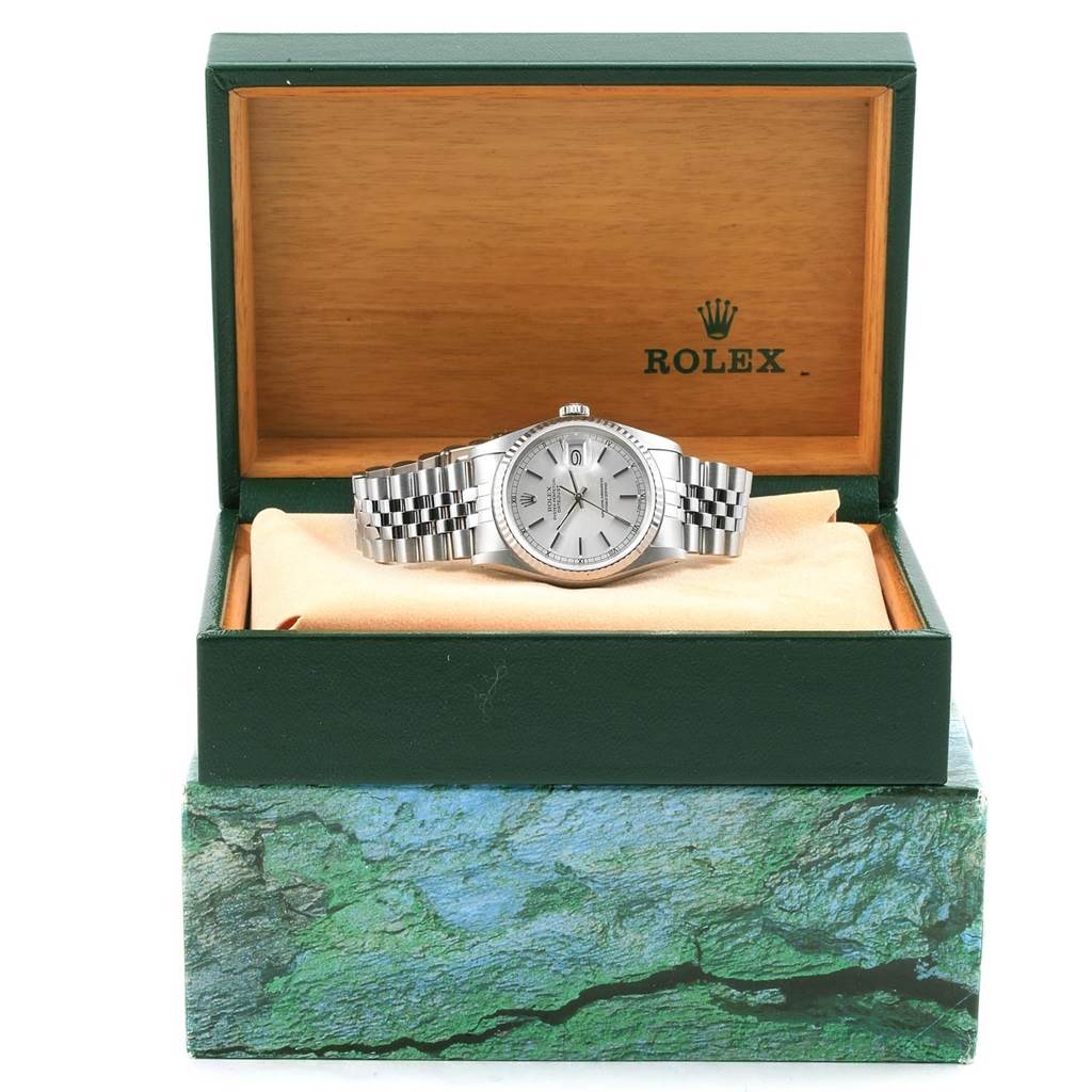 The Rolex Datejust 16234 Men's Stainless Steel Silver Dial 16234 Men's Stainless Steel Silver Dial watch is displayed head-on inside its green box with a visible face and bracelet.