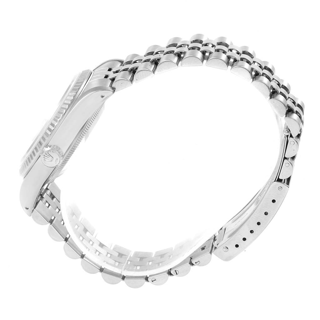 This image shows a side view of a Rolex Datejust 16234 Men's Stainless Steel Silver Dial 16234 Men's Stainless Steel Silver Dial watch highlighting its crown, case, and Jubilee bracelet.