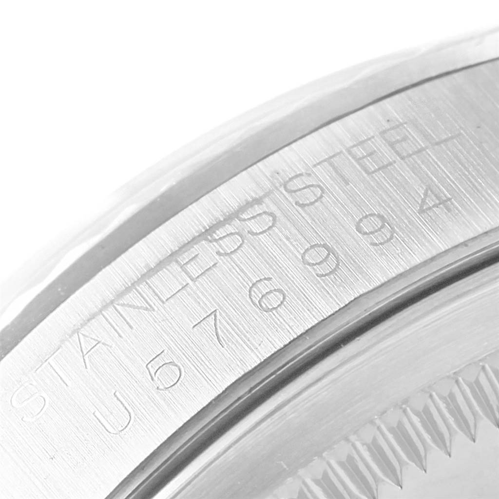 The image shows a close-up of the stainless steel bezel and serial number engraving on a Rolex Datejust 16234 Men's Stainless Steel Black Dial 16234 Men's Stainless Steel Black Dial watch.