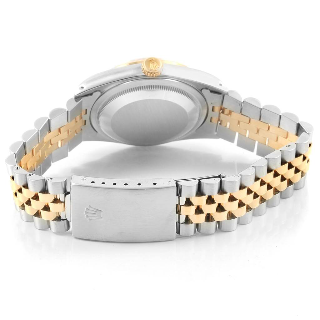 The image shows the back view of a Rolex Datejust 16233 Men's Steel and Gold (two tone) Champagne Dial 16233 Men's Steel and Gold (two tone) Champagne Dial watch, highlighting its silver and gold Jubilee bracelet and clasp.