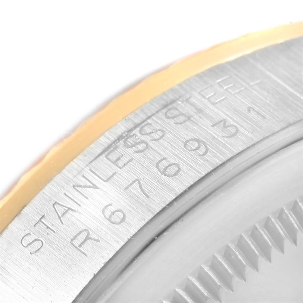 The image shows a close-up of the case back edge with engravings on a Rolex Datejust 16233 Men's Steel and Gold (two tone) Champagne Dial 16233 Men's Steel and Gold (two tone) Champagne Dial watch.