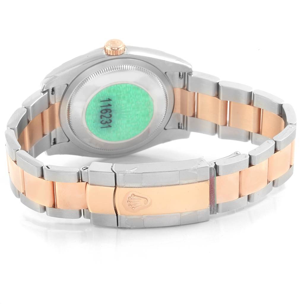 The image shows the back case and bracelet of a Rolex Datejust 116231 Men's Steel and Gold (two tone) Black Dial 116231 Men's Steel and Gold (two tone) Black Dial watch, highlighting its two-tone metal construction and clasp with the logo.