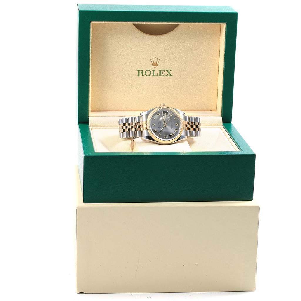 The Rolex Datejust 116233 Men's Stainless Steel Silver Dial 116233 Men's Stainless Steel Silver Dial watch is shown from the front while placed in an open green and cream Rolex box.