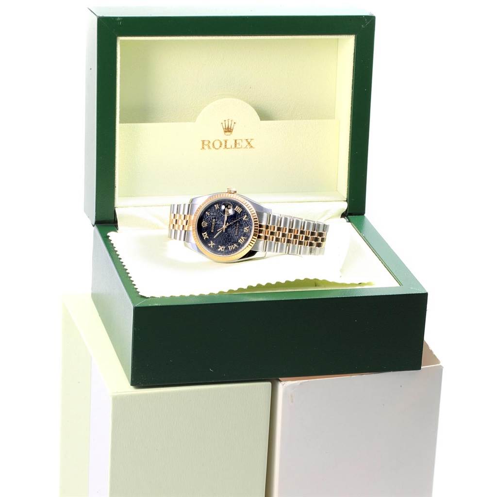 The Rolex Datejust 116233 Men's Stainless Steel Black Dial 116233 Men's Stainless Steel Black Dial watch is shown in an open box, displaying its face and bracelet at a slight angle.