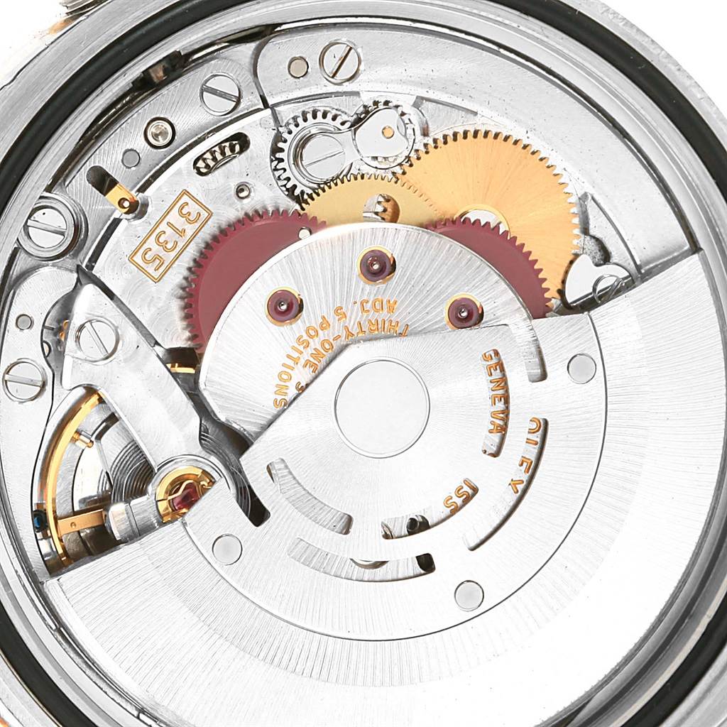 This image shows a close-up view of the Rolex Datejust 116233 Men's Stainless Steel Black Dial 116233 Men's Stainless Steel Black Dial watch movement mechanism and internal components.