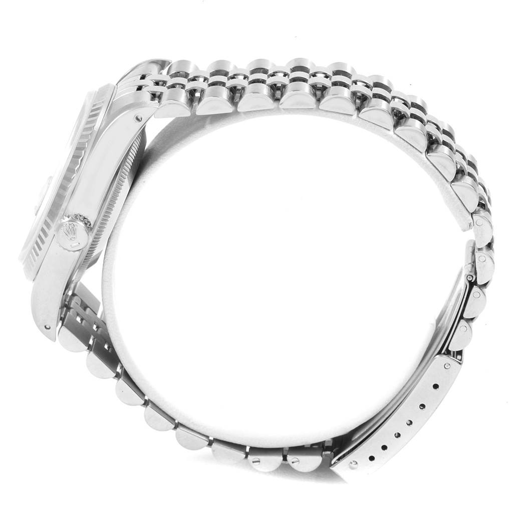 This side view of the Rolex Datejust 16234 Men's Stainless Steel Silver Dial 16234 Men's Stainless Steel Silver Dial watch shows the bracelet, case, and crown.