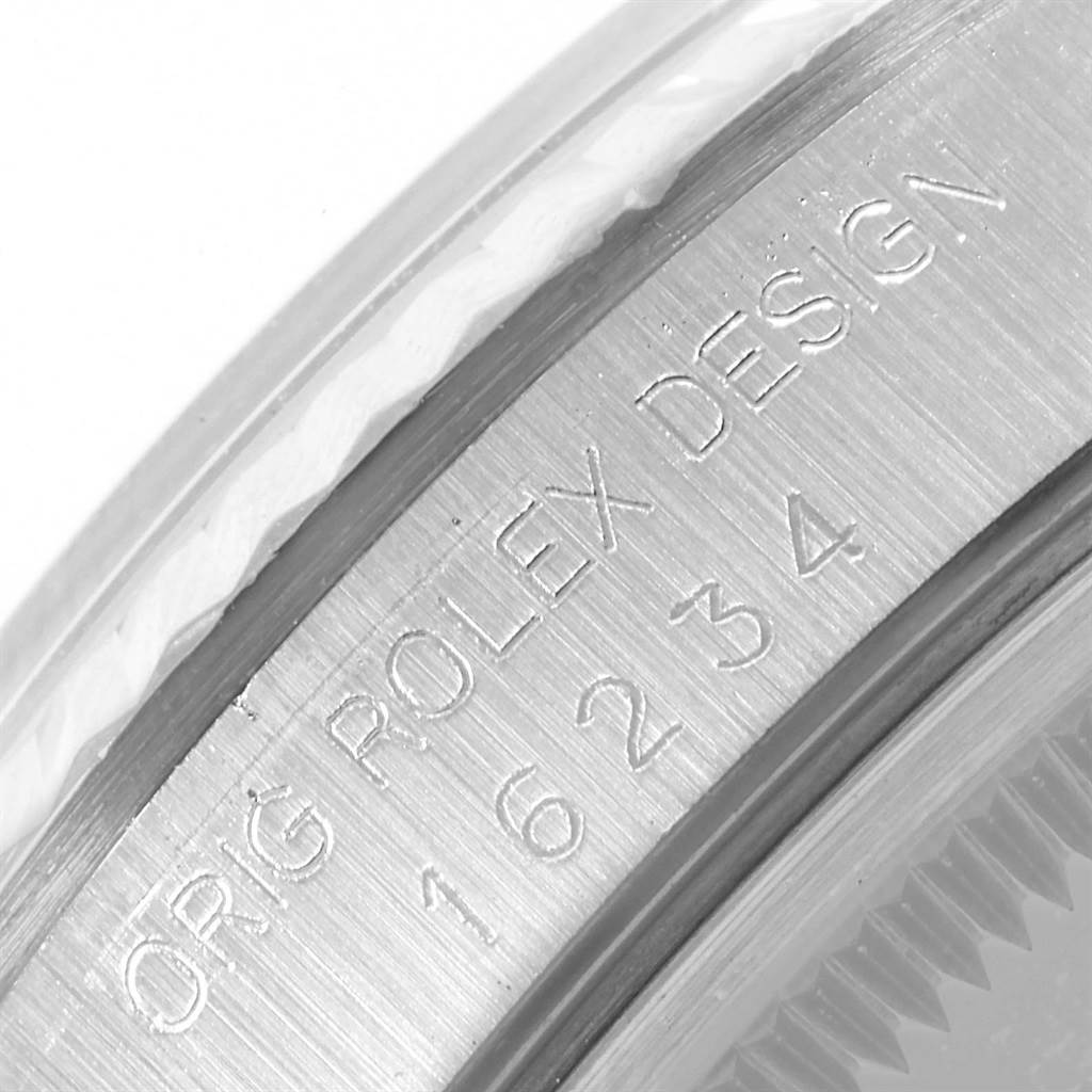 This is a close-up angle showing the engraved bezel of a Rolex Datejust 16234 Men's Stainless Steel Silver Dial 16234 Men's Stainless Steel Silver Dial watch with model details.