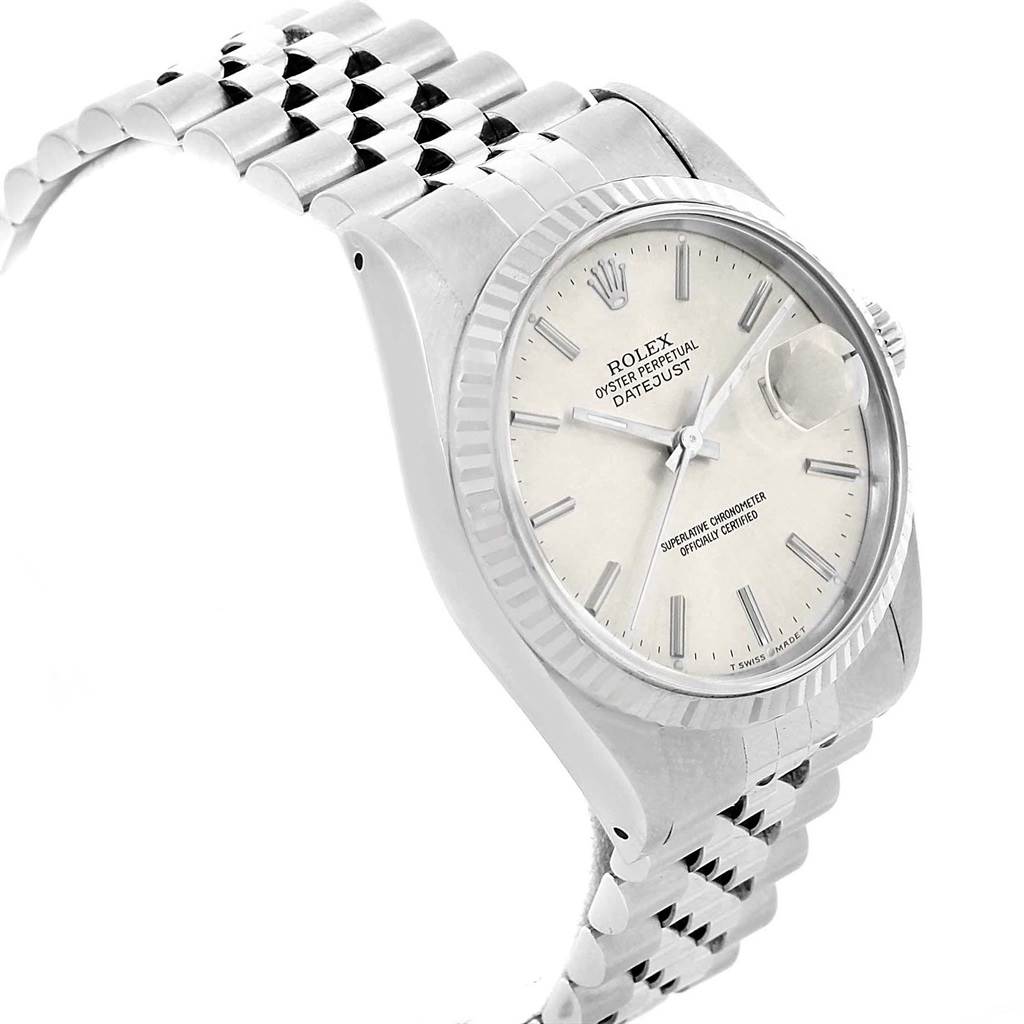 This image shows a Rolex Datejust 16234 Men's Stainless Steel Silver Dial 16234 Men's Stainless Steel Silver Dial model watch from an angled perspective, highlighting the dial, fluted bezel, and Jubilee bracelet.