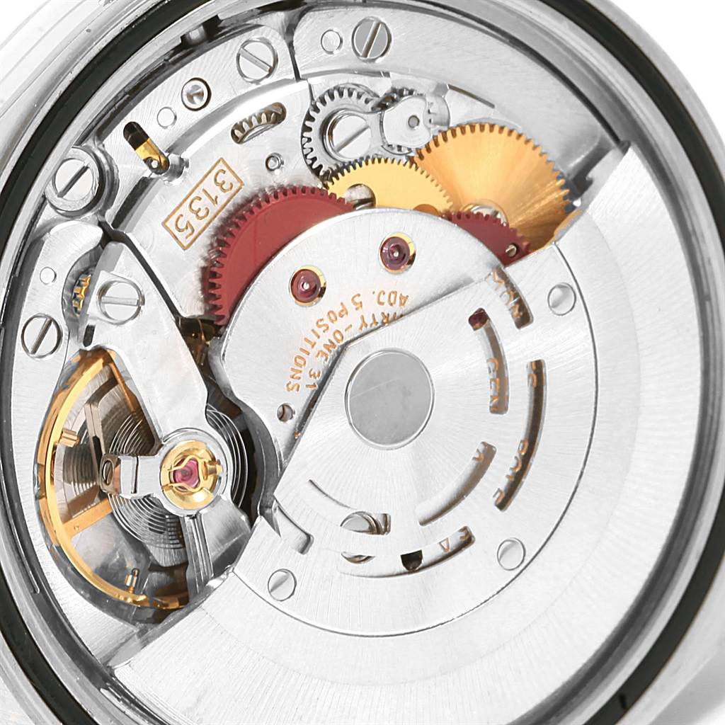 The image shows the intricate internal mechanism of the Rolex Datejust 16234 Men's Stainless Steel Silver Dial 16234 Men's Stainless Steel Silver Dial watch, focusing on the components and gears.